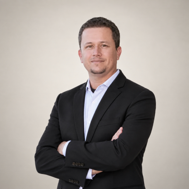 Professional man in black blazer with arms crossed